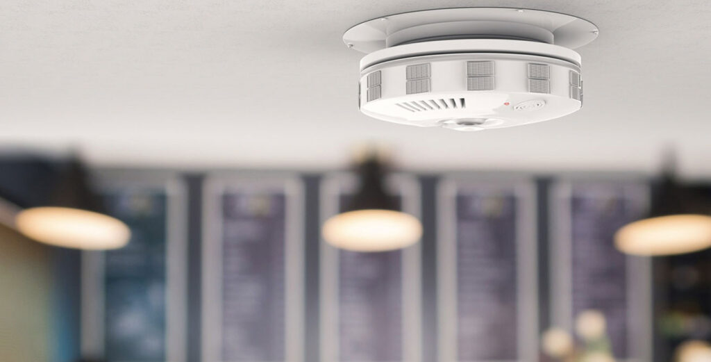 carbon monoxide alarm detector installed on ceiling in a home