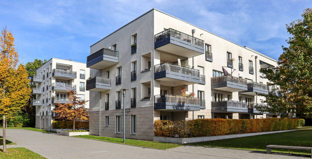 Exterior view of a retrofitted apartment building, Contact